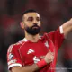 Mohamed Salah célébrant un but sous le maillot rouge de Liverpool à Anfield